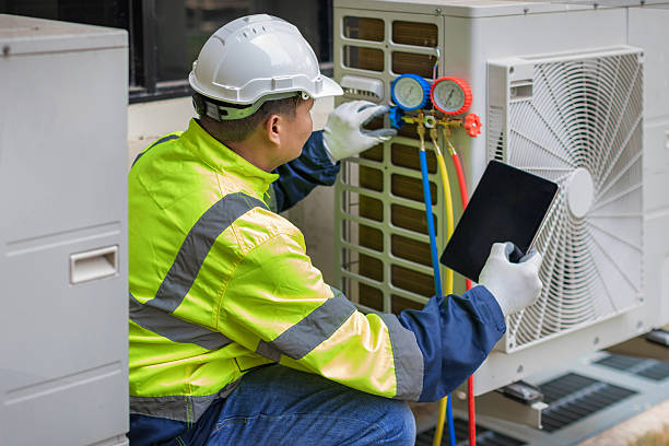 Professional Air Duct Cleaning technician working in Harrison, NJ